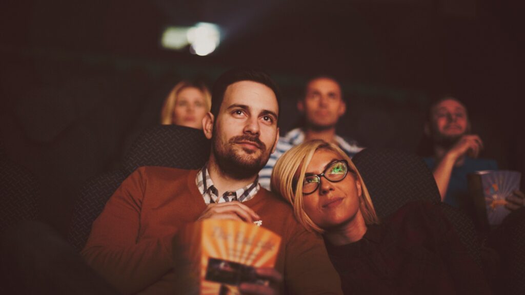 young couple at the cinema watching movie picture id613132922